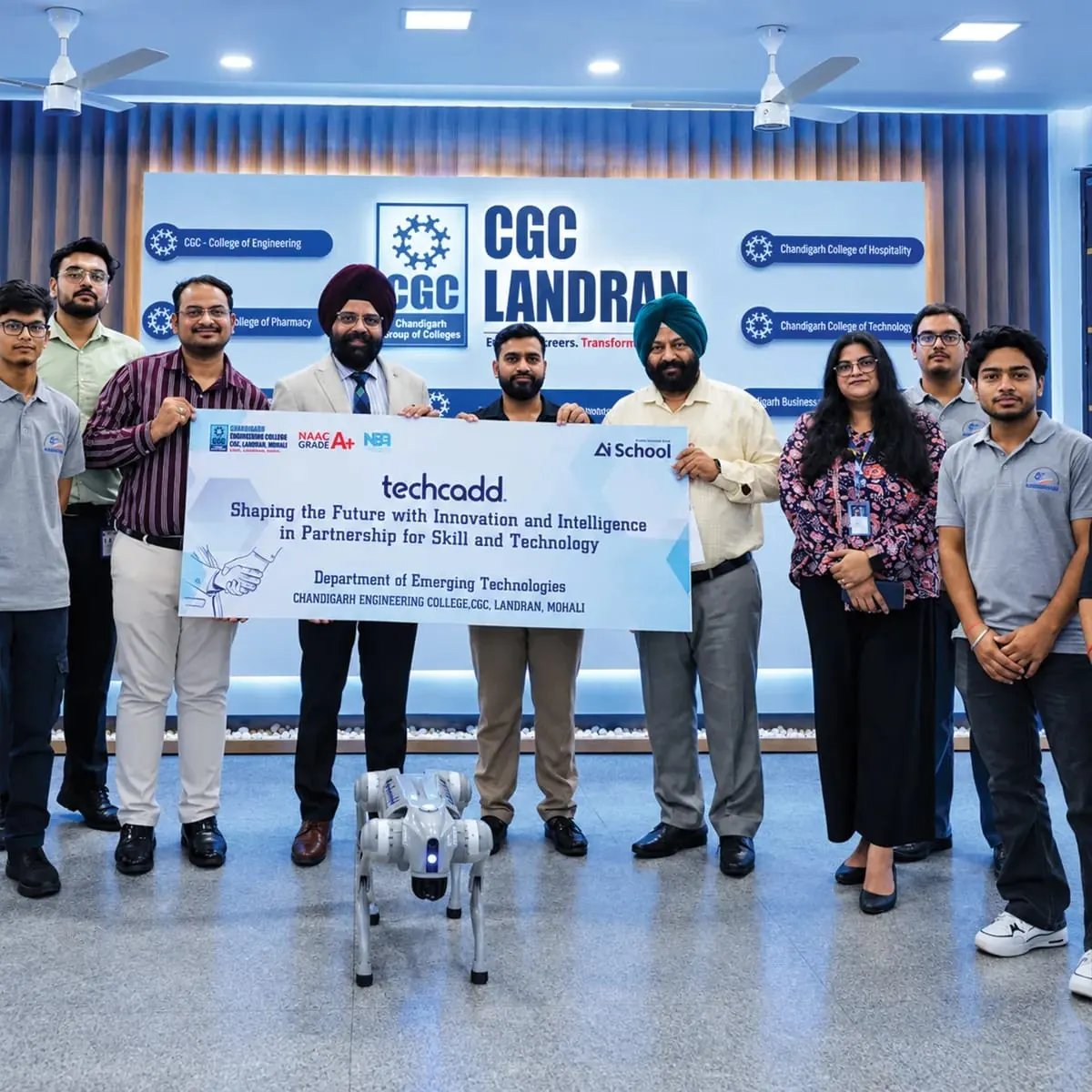 With CGC Landran faculty holding a techcadd partnership banner