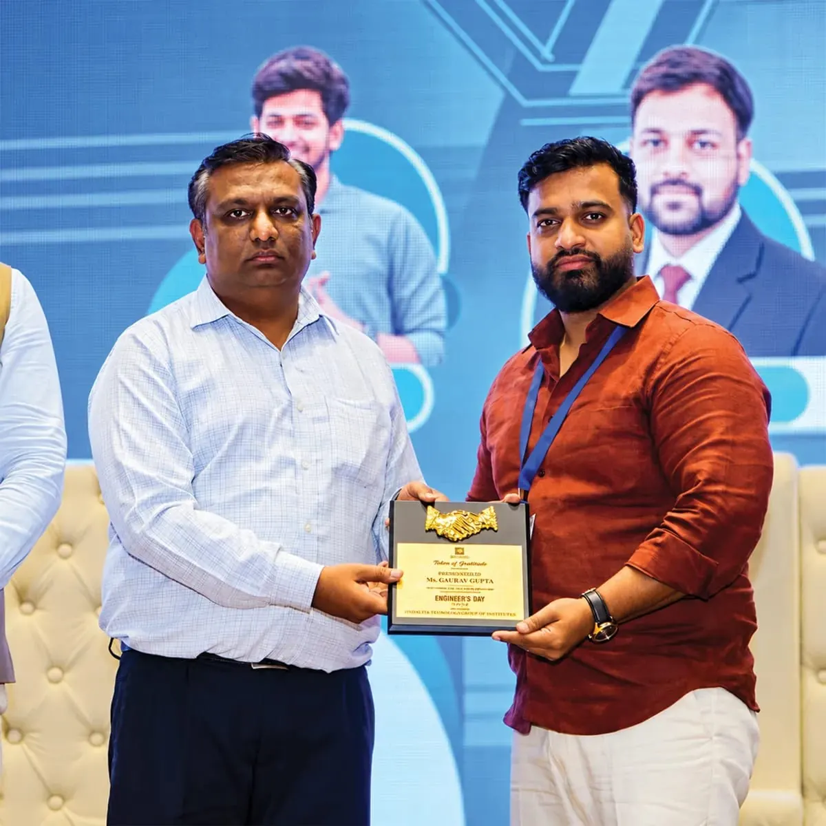 Receiving a token of gratitude at an Engineer's Day event