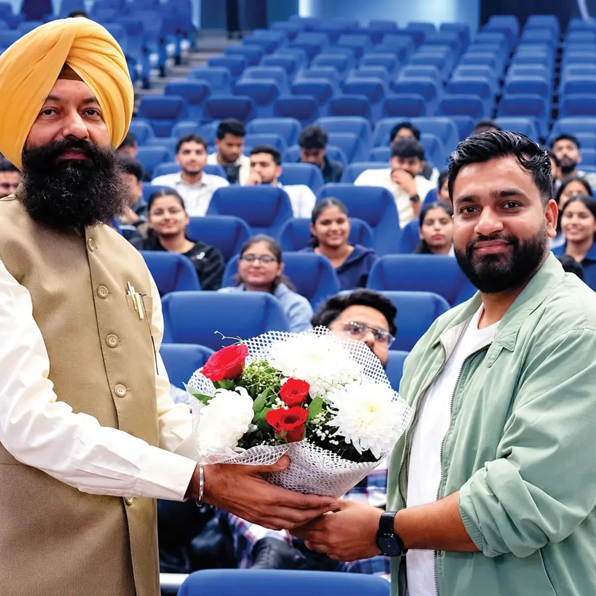Welcomed with a bouquet in front of an auditorium of students